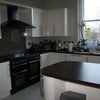 Photo 8: The new kitchen has a double oven, washing machine, microwave, etc.