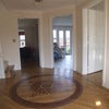 Photo 1: Entrance hall with shared family room and garden visible.