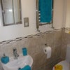 Photo 7: Modern ensuite shower with chrome towel rad, mirror cabinet, shaver point, window & extractor fan
