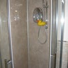 Photo 6: Quality Mira shower with glass enclosure & easy-clean aqua panels