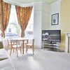 Photo 2: large high ceiling lounge with flat screen tv