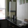 Photo 5: Breakfast bar side of the kitchen
