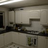 Photo 3: Kitchen with washing machine, oven, fridge freezer and microwave (not shown)
