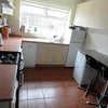 Photo 3: kitchen with dishwasher, dier washing machine and fridges