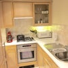 Photo 6: Kitchen with washer dryer and dishwasher