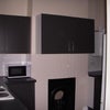 Photo 4: Kitchen with lockable cupboards