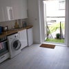 Photo 9: The utility room has a tumble dryer, washer, coffee machines and a breakfast bar.  Doors lead to rea