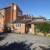 Photo 2: Main house with trellised walk way