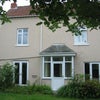 Photo 1: The house and garden