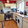 Photo 3: Fully equipped splendid kitchen.