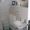 Photo 4: Shower room mirror and sink (toilet next to shower in same room).