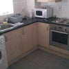 Photo 4: The kitchen - There is an oven, microwave and washing machine but no dryer (I just use airing racks.