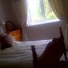 Photo 4: The room - can put a more neutral set of curtains and bedding in for males!