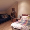 Photo 5: Large Attic Double Bedroom, with sofa and storage 