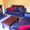 Photo 3: Cosy lounge with leather sofas and open fire