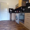 Photo 2: Kitchen includes appliances and dishwasher