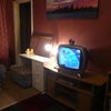 Photo 2: Bedroom showing walk in wardrobe,TV, freeview box and bookcase