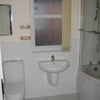 Photo 4: Half tiled p bath suite and also a wet room