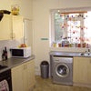 Photo 3: A kitsch kitchen, complete with glitter ball