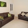 Photo 2: Lounge with 2 x sofas, flat screen TV