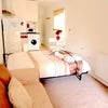 Photo 9: Spacious Sofa and Real bed 