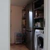 Photo 9: Utility room with washing machine, fridge freezer and microwave.