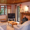 Photo 1: Lounge with views to garden and orchard.