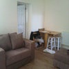 Photo 4: Sitting room, door into kitchen 