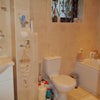 Photo 4: The Bathroom/shower