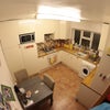 Photo 4: Kitchen (fisheye makes it look tiny)