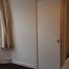 Photo 3: bed, part of bay window & ensuite toliet/wash basin door closed