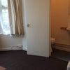 Photo 4: bed, part of bay window & ensuite toilet & washbasin door open 