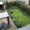 Photo 9: Sunny front garden with bike shed and pergola & patio for chilling :)