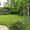 Photo 5: left lawn, canal access is behind camera