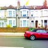 Photo 1: View of the house from outside