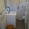 Photo 4: Bathroom sink, radiator,mirror
