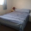 Photo 2: Rm 1, double bed, desk and built in cupboard and drawers not in view
