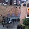 Photo 4: The back yard complete with washing room, BBQ and patio area
