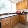 Photo 8: Downstairs Kitchen