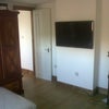 Photo 3: Living area with T.V etc