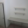 Photo 5: desk/shelving and built in wardrobe in bedroom