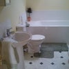 Photo 3: bathroom has shower and bath