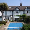 Photo 3: rear of house with pool