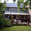 Photo 1: Rear view of house
