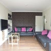 Photo 1: Main Living room with 2 large leather sofas, flat screen TV and doors out into the garden.