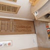 Photo 4: Baskets and towel rail on the back of the door