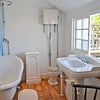 Photo 2: The Cottage bathroom with air slipper bath and dressing table style sink
