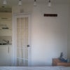 Photo 2: Kitchen area to left, microwave, kettle and cutlery etc supplied if required