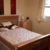 Photo 5: Double size bedroom with bed, drawers and wardrobea