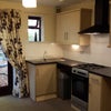 Photo 3: Newly fitted kitchen with gas cooker, under unit lighting and extractor fan 